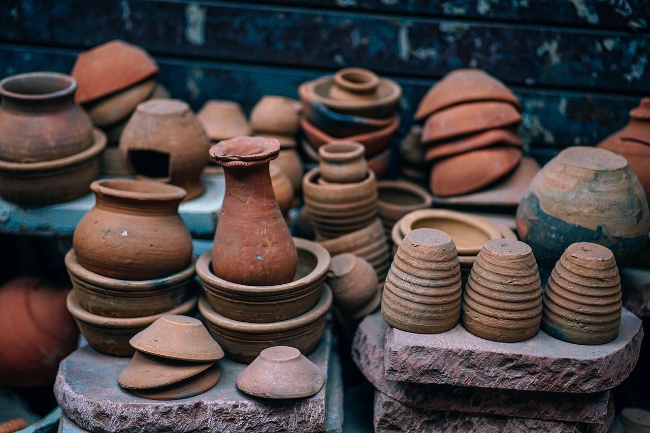 Handmade terracotta ceramic pot on a studio workbench